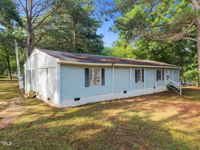 302 Allen Ave, Franklinton, NC 27525 - view of front facade featuring crawl space, entry steps, roof with shingles, and a front yard