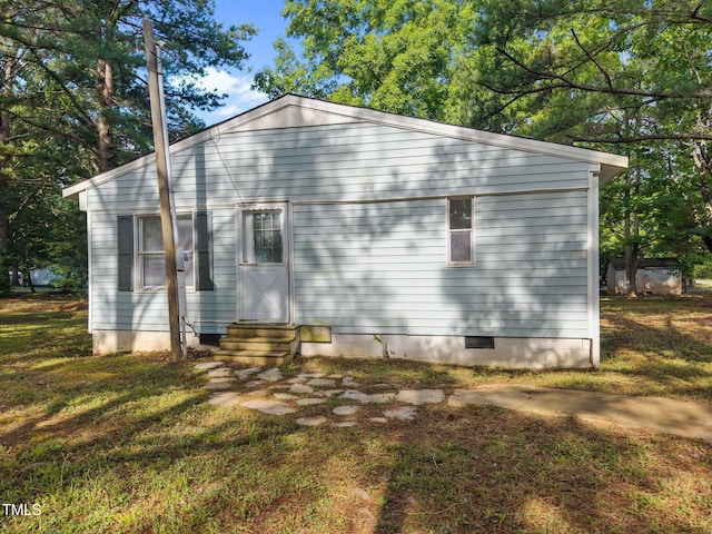 302 Allen Ave, Franklinton, NC 27525 - view of side of home with entry steps, crawl space, and a lawn