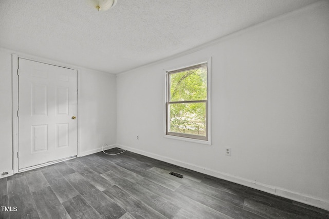 302 Allen Ave, Franklinton, NC 27525 - unfurnished bedroom with a textured ceiling and dark wood-type flooring