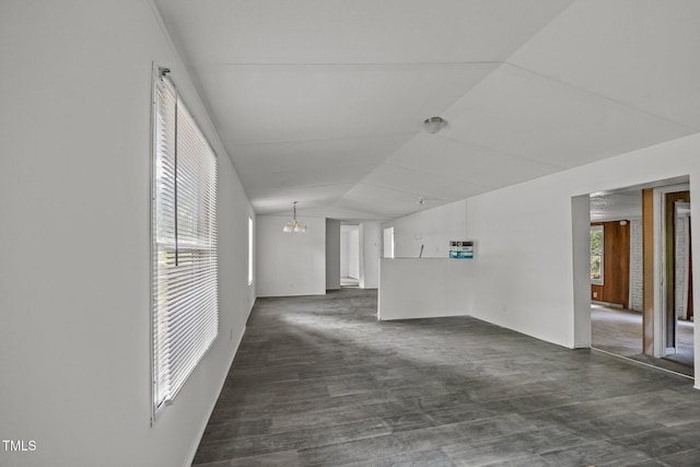 302 Allen Ave, Franklinton, NC 27525 - spare room with plenty of natural light, lofted ceiling, a chandelier, and dark wood-type flooring
