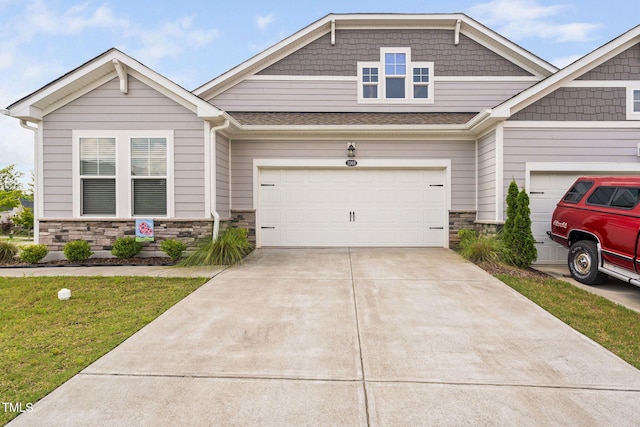 1066 Bingley Dr, Durham, NC 27703 - craftsman house featuring stone siding, concrete driveway, and a front lawn