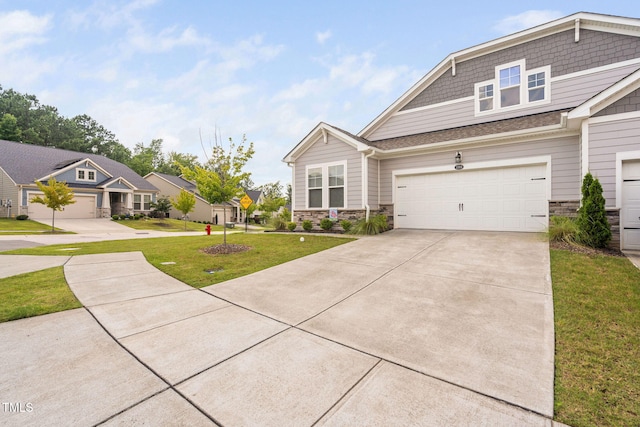 1066 Bingley Dr, Durham, NC 27703 - craftsman-style home featuring stone siding, driveway, a front lawn, and a garage