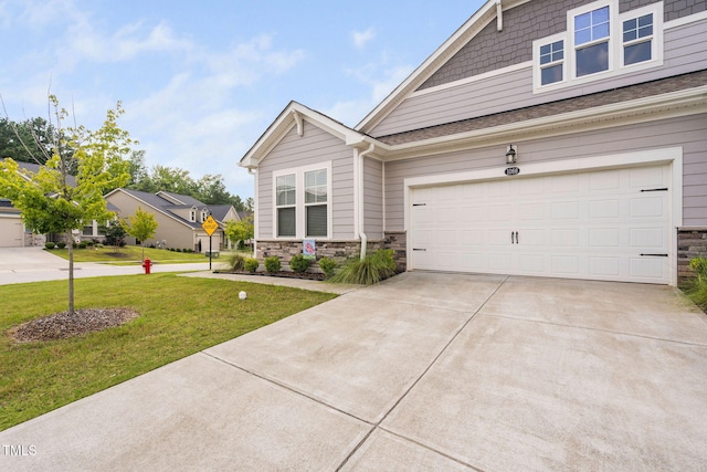 1066 Bingley Dr, Durham, NC 27703 - craftsman inspired home featuring driveway, stone siding, and a front yard