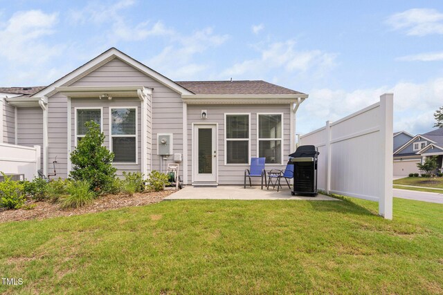 1066 Bingley Dr, Durham, NC 27703 - rear view of house with a patio and roof with shingles