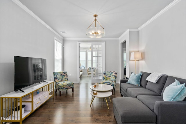 1066 Bingley Dr, Durham, NC 27703 - living room with wood finished floors, a chandelier, crown molding, and ceiling fan