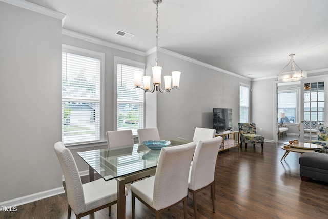 1066 Bingley Dr, Durham, NC 27703 - dining area with a chandelier, dark wood-style floors, and ornamental molding