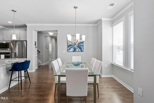 1066 Bingley Dr, Durham, NC 27703 - dining space featuring stairway, a chandelier, ornamental molding, dark wood finished floors, and recessed lighting