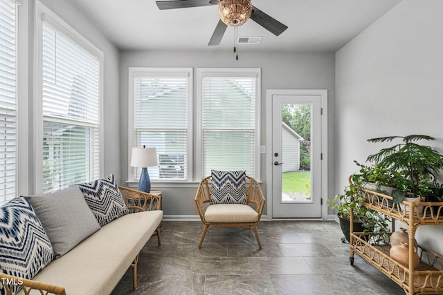 1066 Bingley Dr, Durham, NC 27703 - living area featuring plenty of natural light, a ceiling fan, and stone finish floors