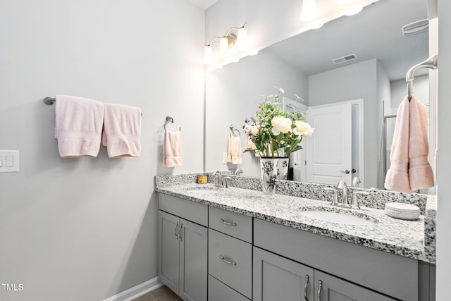 1066 Bingley Dr, Durham, NC 27703 - bathroom with double vanity and tile patterned floors