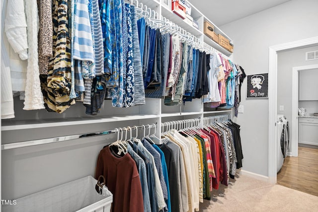 1066 Bingley Dr, Durham, NC 27703 - spacious closet with washing machine and dryer and carpet flooring