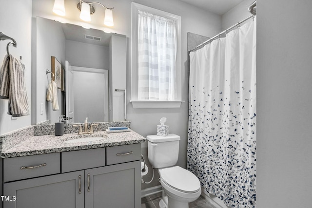 1066 Bingley Dr, Durham, NC 27703 - bathroom with vanity and a shower with curtain
