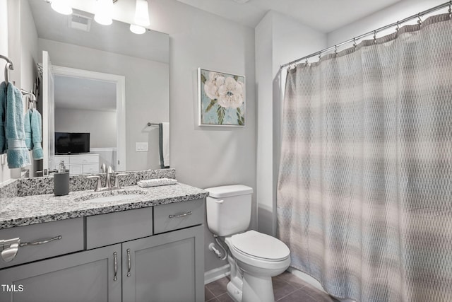 1066 Bingley Dr, Durham, NC 27703 - bathroom featuring tile patterned floors, vanity, and curtained shower