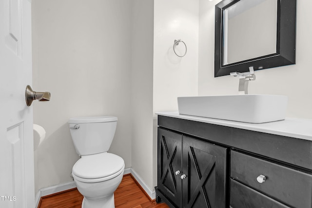 7 Nadeau Ct, Durham, NC 27704 - bathroom featuring vanity and wood finished floors