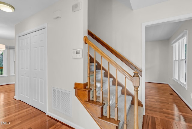 7 Nadeau Ct, Durham, NC 27704 - stairway featuring wood finished floors and baseboards