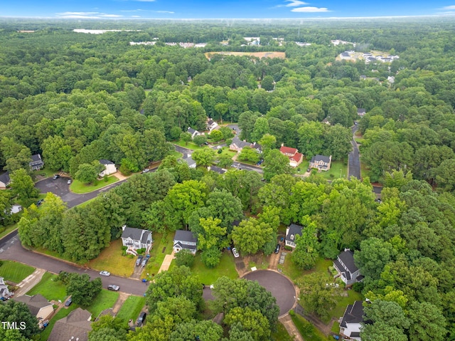 7 Nadeau Ct, Durham, NC 27704 - aerial view of property and surrounding area featuring a heavily wooded area
