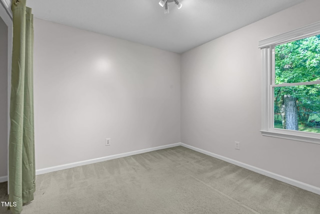7 Nadeau Ct, Durham, NC 27704 - carpeted empty room with baseboards