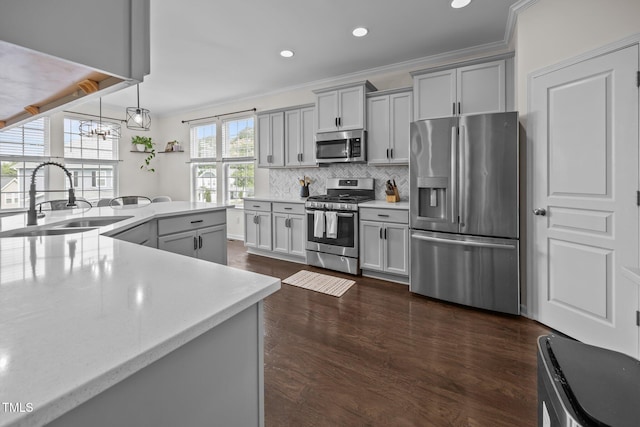 1304 Bromby Ave, Knightdale, NC 27545 - kitchen featuring appliances with stainless steel finishes, gray cabinets, backsplash, dark wood-type flooring, and recessed lighting