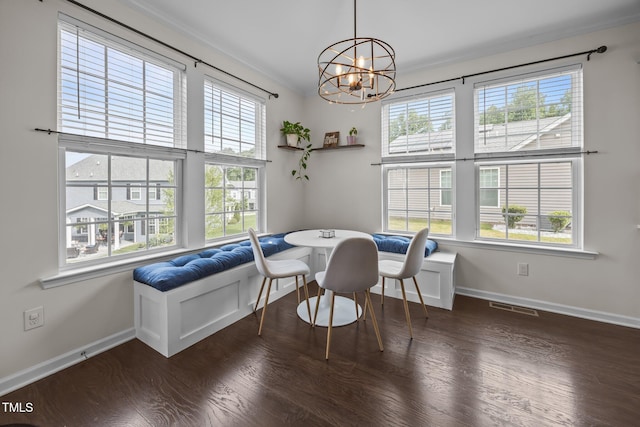 1304 Bromby Ave, Knightdale, NC 27545 - dining room featuring crown molding, a chandelier, and wood finished floors