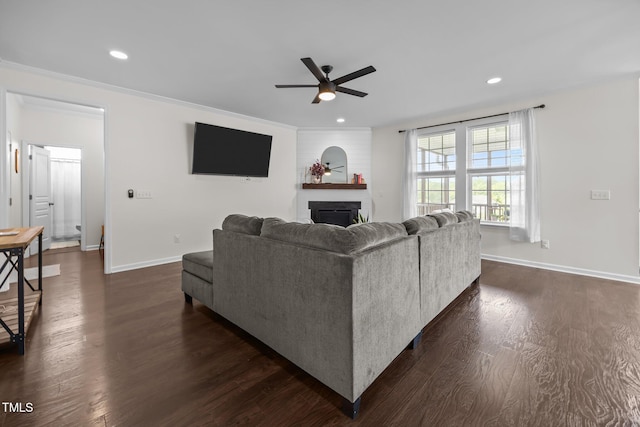 1304 Bromby Ave, Knightdale, NC 27545 - living area with ceiling fan, a large fireplace, dark wood finished floors, and recessed lighting