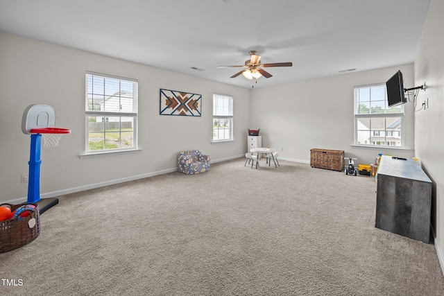 1304 Bromby Ave, Knightdale, NC 27545 - rec room with healthy amount of natural light, carpet, and ceiling fan