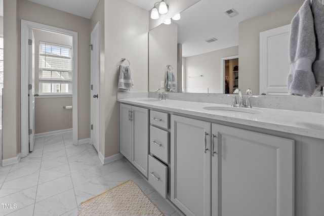 1304 Bromby Ave, Knightdale, NC 27545 - full bathroom with marble look tiles and double vanity