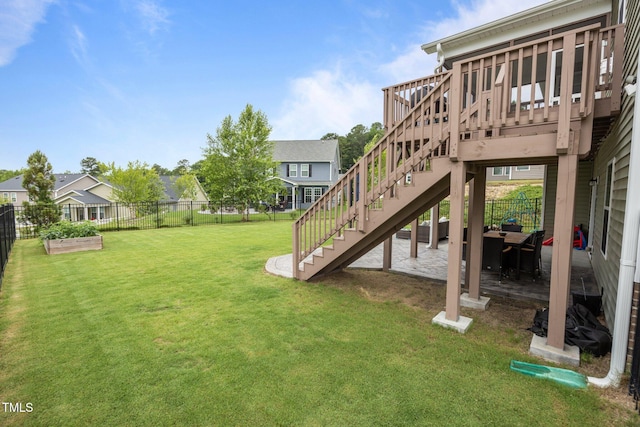 1304 Bromby Ave, Knightdale, NC 27545 - fenced backyard with stairway, a wooden deck, a garden, and a residential view