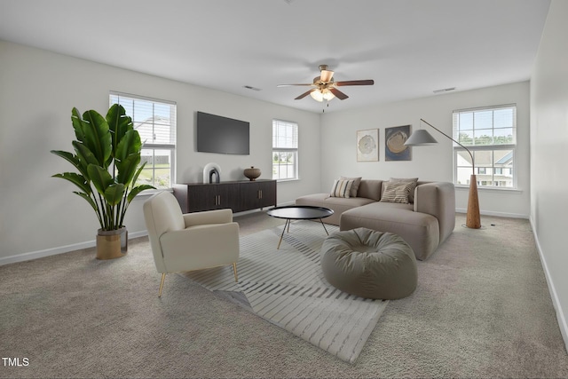 1304 Bromby Ave, Knightdale, NC 27545 - living area featuring healthy amount of natural light, a ceiling fan, and carpet flooring