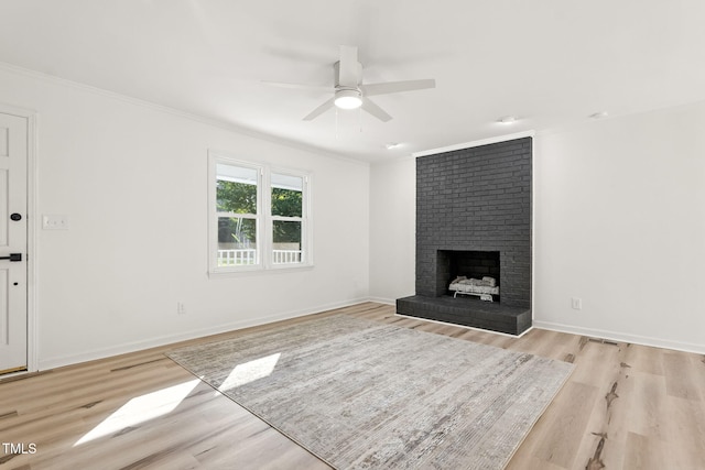 104 S Nikol Way, Clayton, NC 27520 - unfurnished living room featuring ornamental molding, ceiling fan, light wood finished floors, and a fireplace