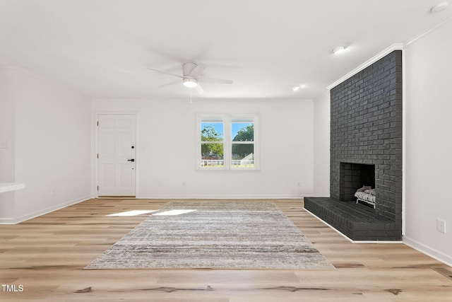 104 S Nikol Way, Clayton, NC 27520 - unfurnished living room featuring ceiling fan, wood finished floors, a fireplace, and ornamental molding