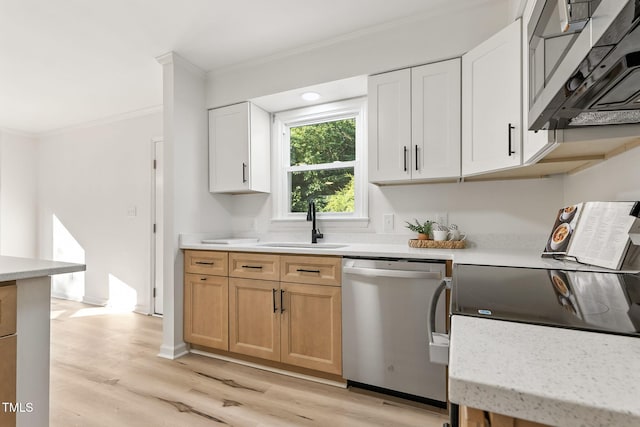 104 S Nikol Way, Clayton, NC 27520 - kitchen featuring stainless steel appliances, crown molding, light wood finished floors, light countertops, and white cabinetry