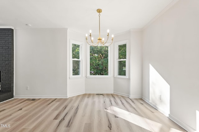104 S Nikol Way, Clayton, NC 27520 - unfurnished dining area featuring a chandelier, wood finished floors, crown molding, and a fireplace
