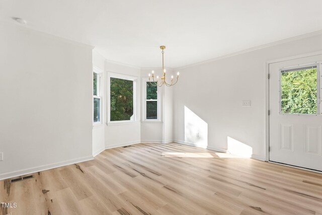 104 S Nikol Way, Clayton, NC 27520 - unfurnished dining area with a chandelier, light wood finished floors, and crown molding