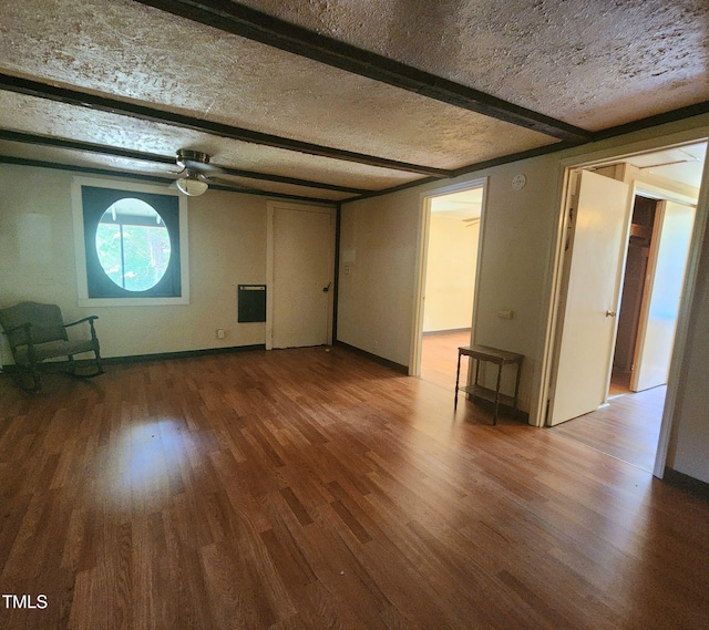 1080 Kudzu Ln, Danbury, NC 27016 - unfurnished living room with wood finished floors and beamed ceiling