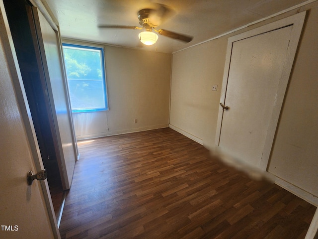 1080 Kudzu Ln, Danbury, NC 27016 - unfurnished bedroom with dark wood finished floors and ceiling fan