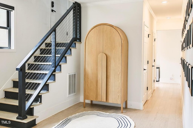1523 Ivy Ln, Raleigh, NC 27609 - stairway with wood finished floors, ornamental molding, and recessed lighting