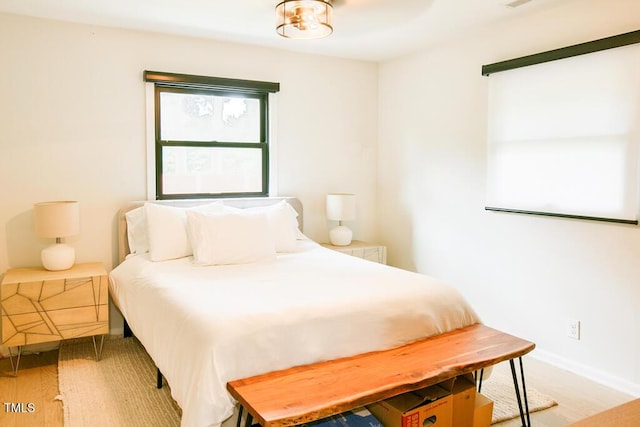 1523 Ivy Ln, Raleigh, NC 27609 - bedroom with light wood-type flooring and baseboards