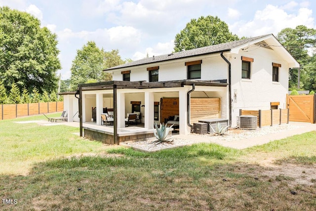 1523 Ivy Ln, Raleigh, NC 27609 - rear view of house with a patio area, an outdoor living space, brick siding, and a gate