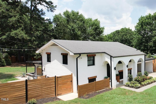 1523 Ivy Ln, Raleigh, NC 27609 - view of front of house with a shingled roof, a fenced front yard, and a gate