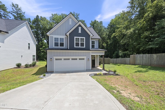 1254 Camden Ave, Durham, NC 27701 - view of front of property with board and batten siding, driveway, and an attached garage