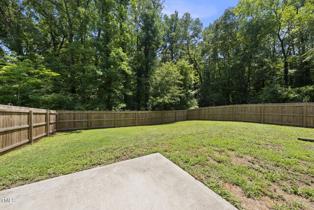 1254 Camden Ave, Durham, NC 27701 - fenced backyard with a patio