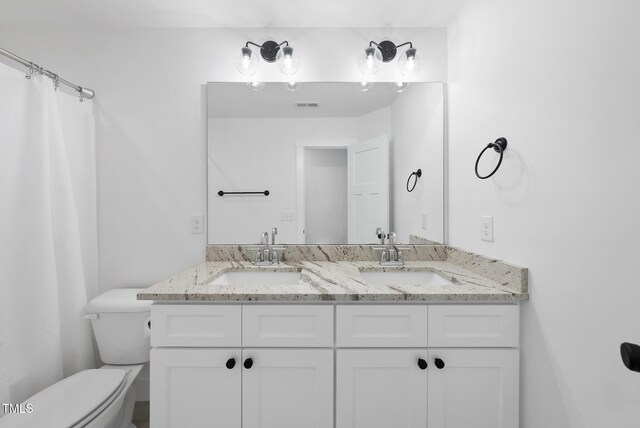 1254 Camden Ave, Durham, NC 27701 - full bath featuring double vanity and toilet