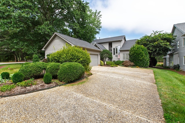 2944 Ballybunion Way, Raleigh, NC 27613 - view of front of home with concrete driveway, a garage, and a front yard