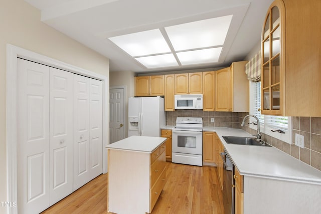 2944 Ballybunion Way, Raleigh, NC 27613 - kitchen with white appliances, light brown cabinets, a center island, backsplash, and light wood-style floors