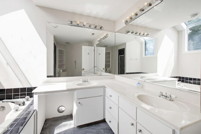 2944 Ballybunion Way, Raleigh, NC 27613 - bathroom with double vanity, a bath, and tile patterned flooring
