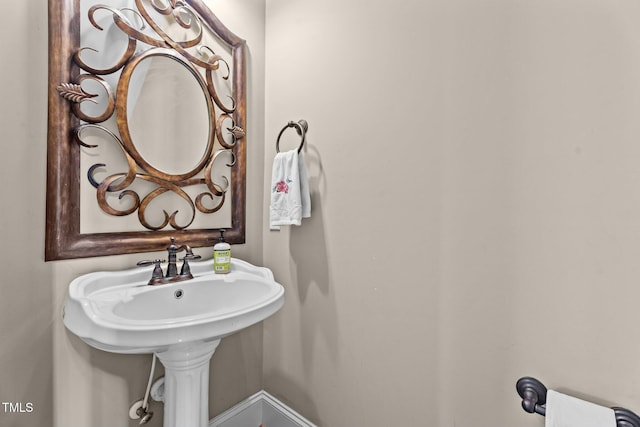 1012 Tavernier Knoll Ln, Raleigh, NC 27603 - bathroom featuring baseboards and a sink