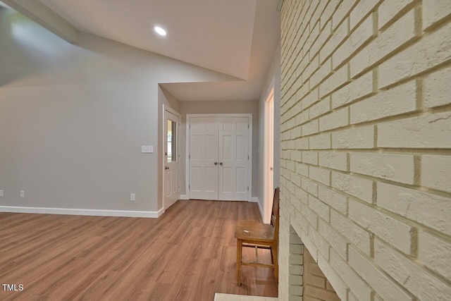 369 Historic Village Dr, Roxboro, NC 27574 - entryway with lofted ceiling, wood finished floors, recessed lighting, and brick wall