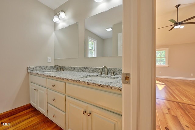 369 Historic Village Dr, Roxboro, NC 27574 - bathroom featuring double vanity, wood finished floors, plenty of natural light, and a ceiling fan