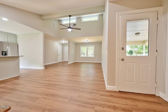 369 Historic Village Dr, Roxboro, NC 27574 - unfurnished living room with a ceiling fan and light wood-type flooring