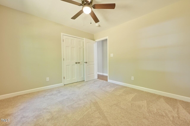 369 Historic Village Dr, Roxboro, NC 27574 - unfurnished bedroom featuring light colored carpet, a closet, and ceiling fan