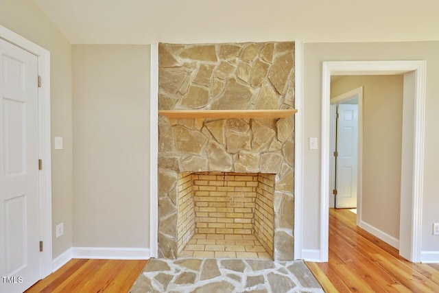 369 Historic Village Dr, Roxboro, NC 27574 - detailed view of wood finished floors and a stone fireplace